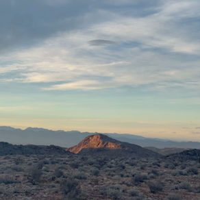 Campsite overlooking valley and mountains