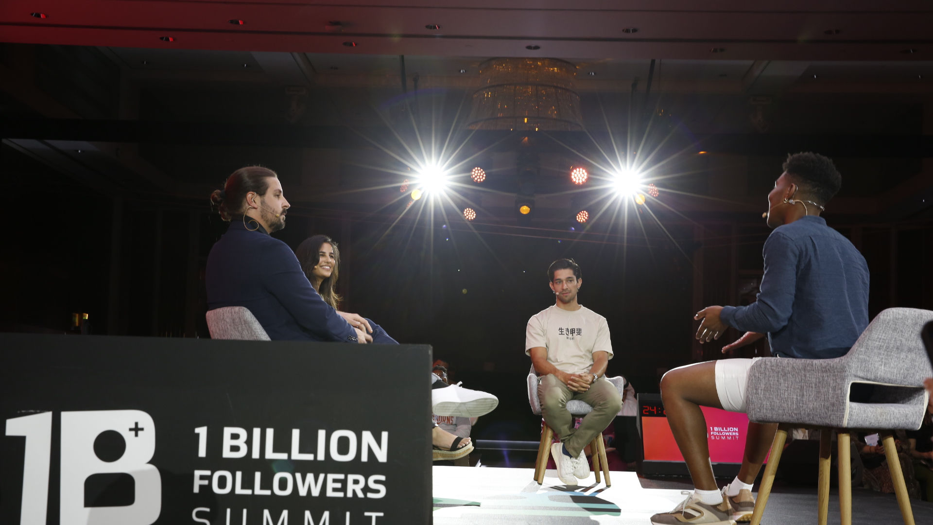 Corporate event photography showing a panel discussion at a professional conference