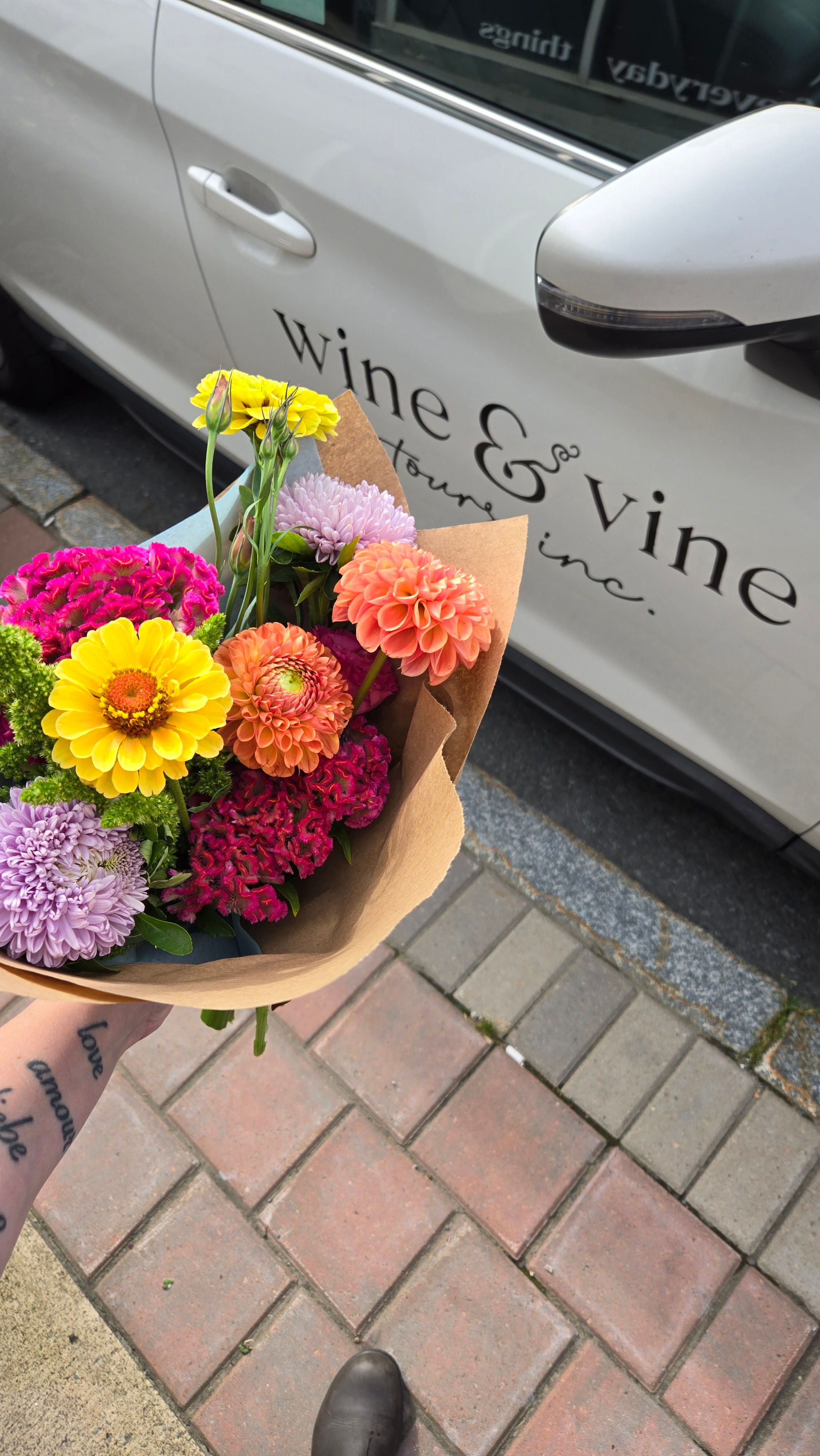 Flowers with the Wine & Vine logo