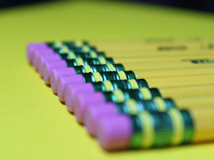 Pencils lined in a perfect row