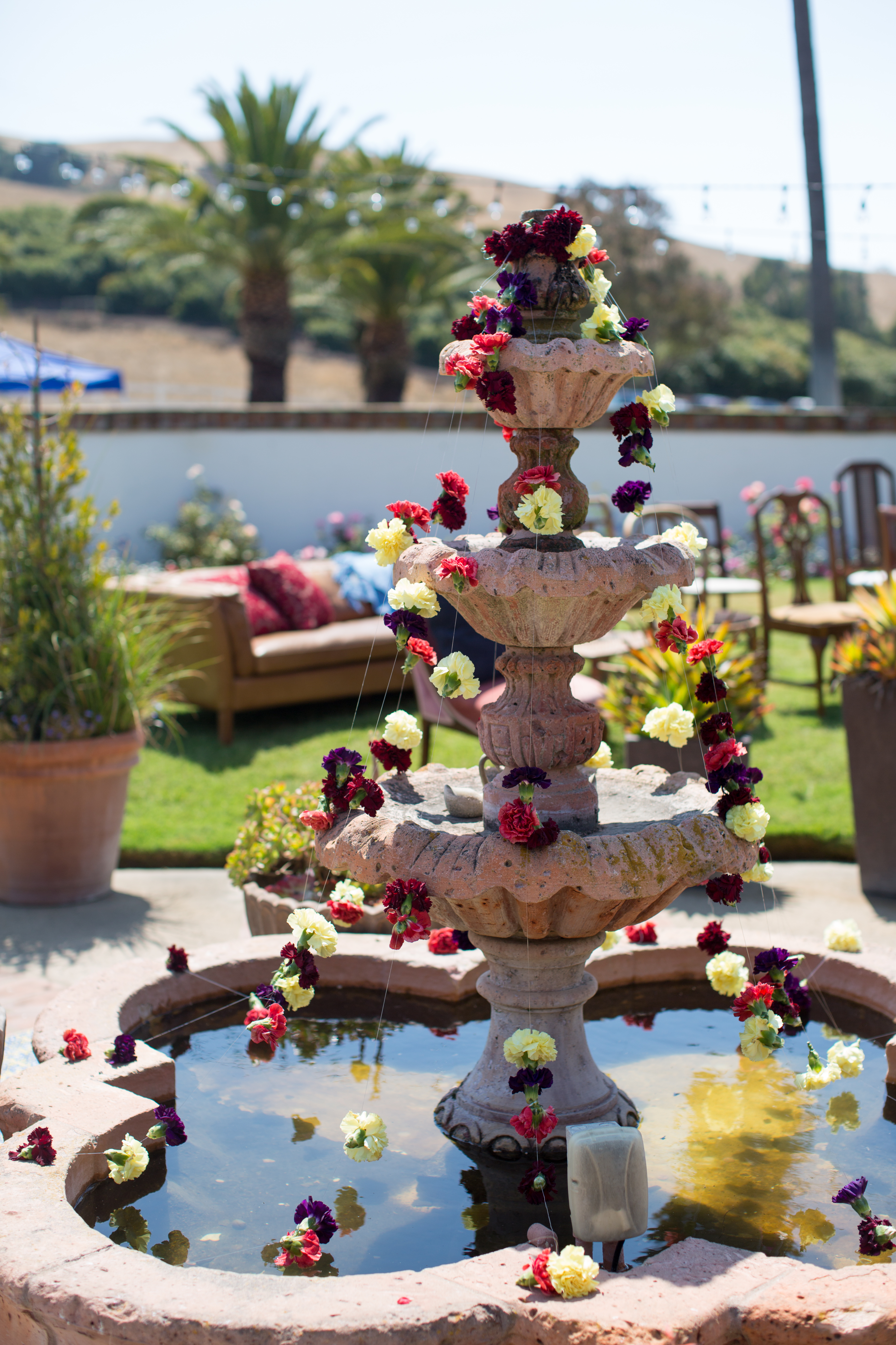 Flower garland on courtyard fountain