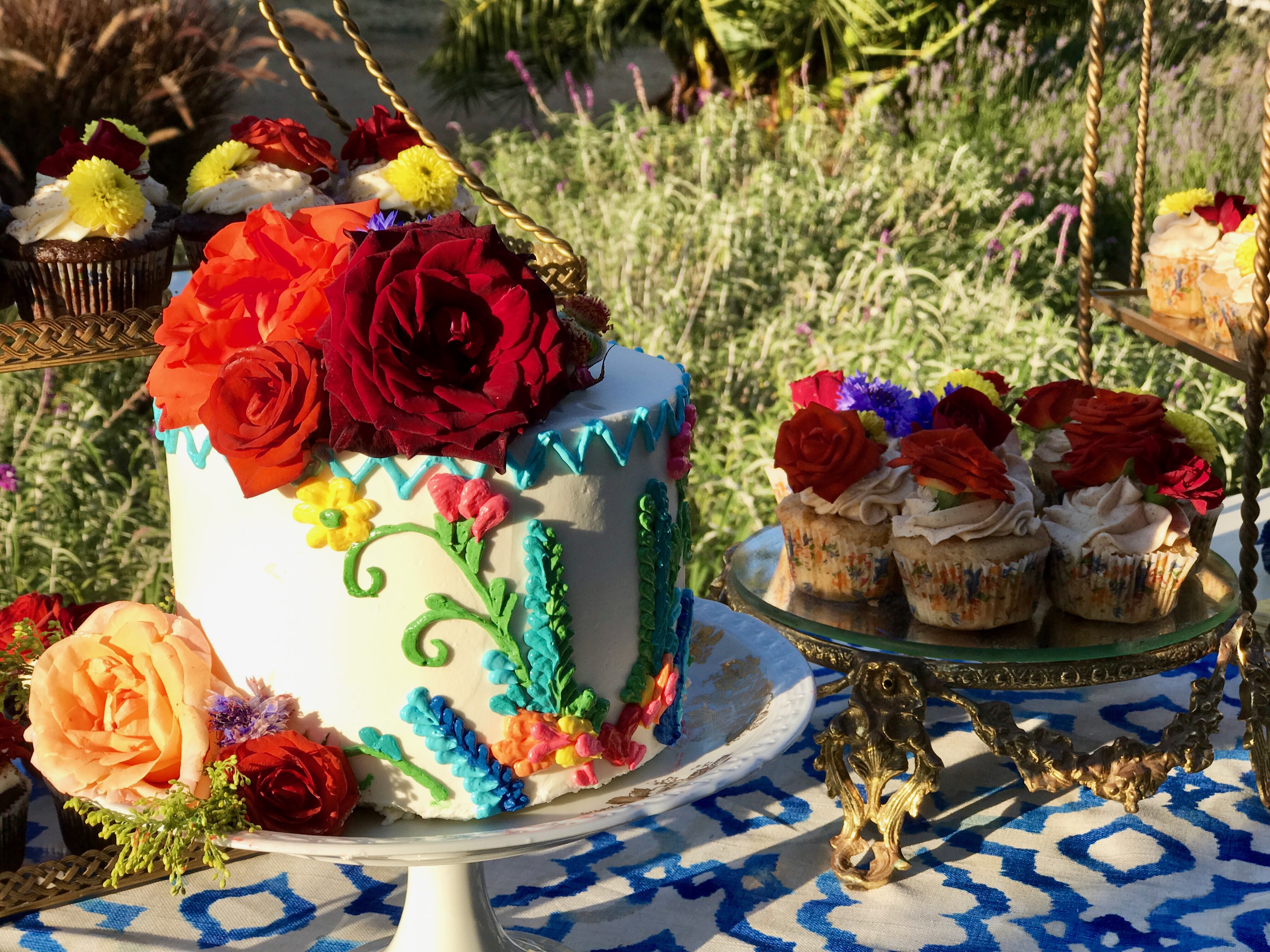 Colorful cake and cupcakes