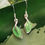 Thumbnail: green leaf earrings hanging on a leaf