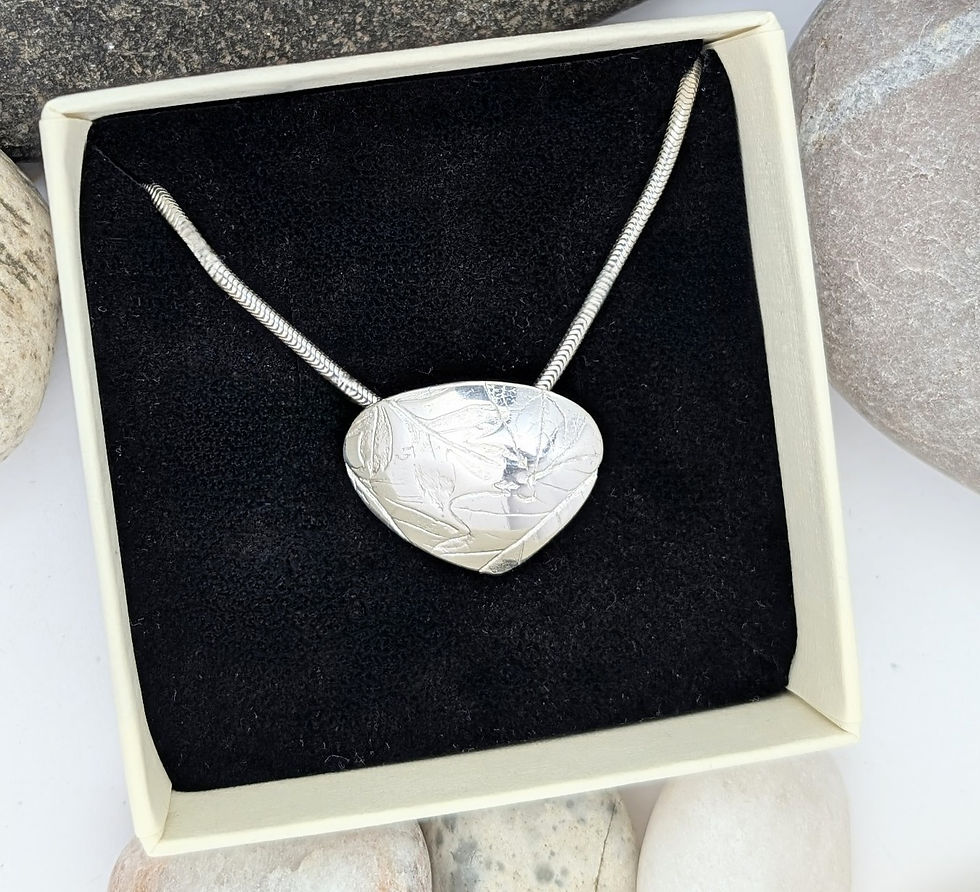 silver eucalyptus necklace in a gift box close up