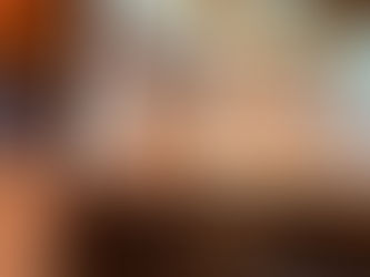 Woman speaking on stage in front of a screen