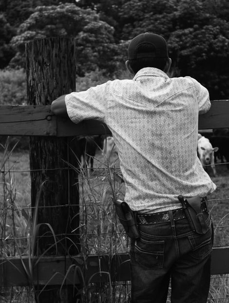 A professional black and white photo of a rancher