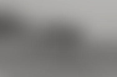 Wedding couple embrace on misty Cornish beach