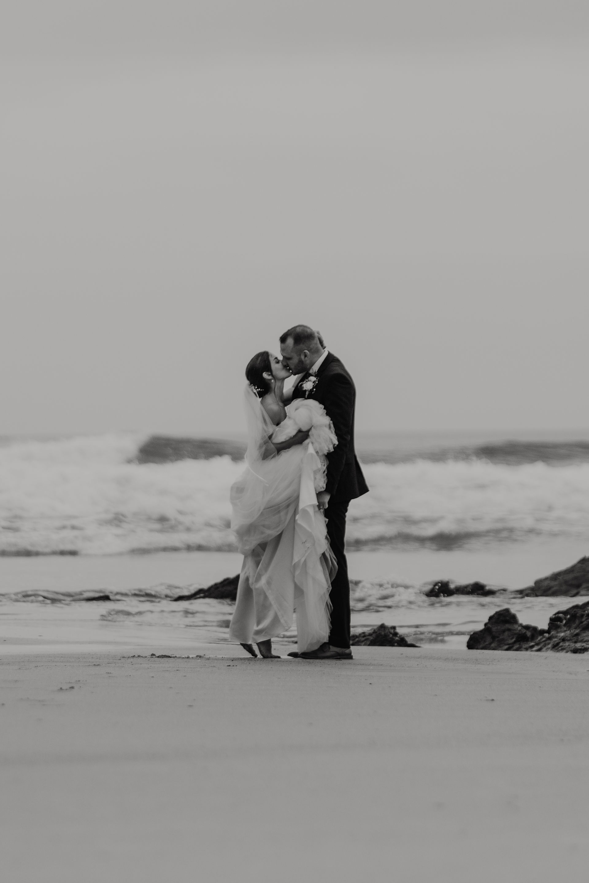 Rainy kisses on the beach at Lusty Glaze