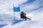Racer rounding blue panel gate