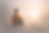Illustration of a person sitting in reflection with a gradual shift from muted to warmer light, representing how understanding develops over time through formulation in therapy