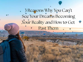 Woman in coat and wooly hat watch as lots of hot air balloons float through the sky with blog title in text: 3 Reasons Why You Can’t See Your Dreams Becoming Your Reality and How to Get Past Them