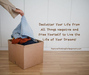 Box of discarded clothes with blog title: Declutter Your Life from All Things Negative and Free Yourself to Live the Life of Your Dreams!