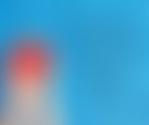 Blue wooden background with two hands holed a red heart shape - with blog title added: 32 Quotes on How Self-Love and Self-Care Go Hand in Hand