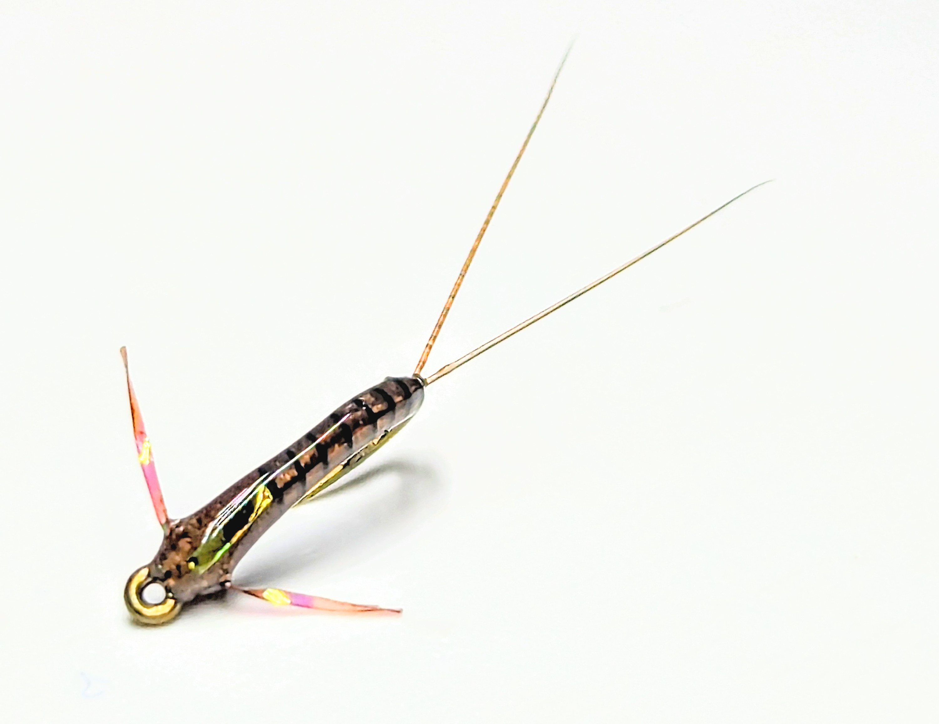 A delicate hair wing dun trout fly.