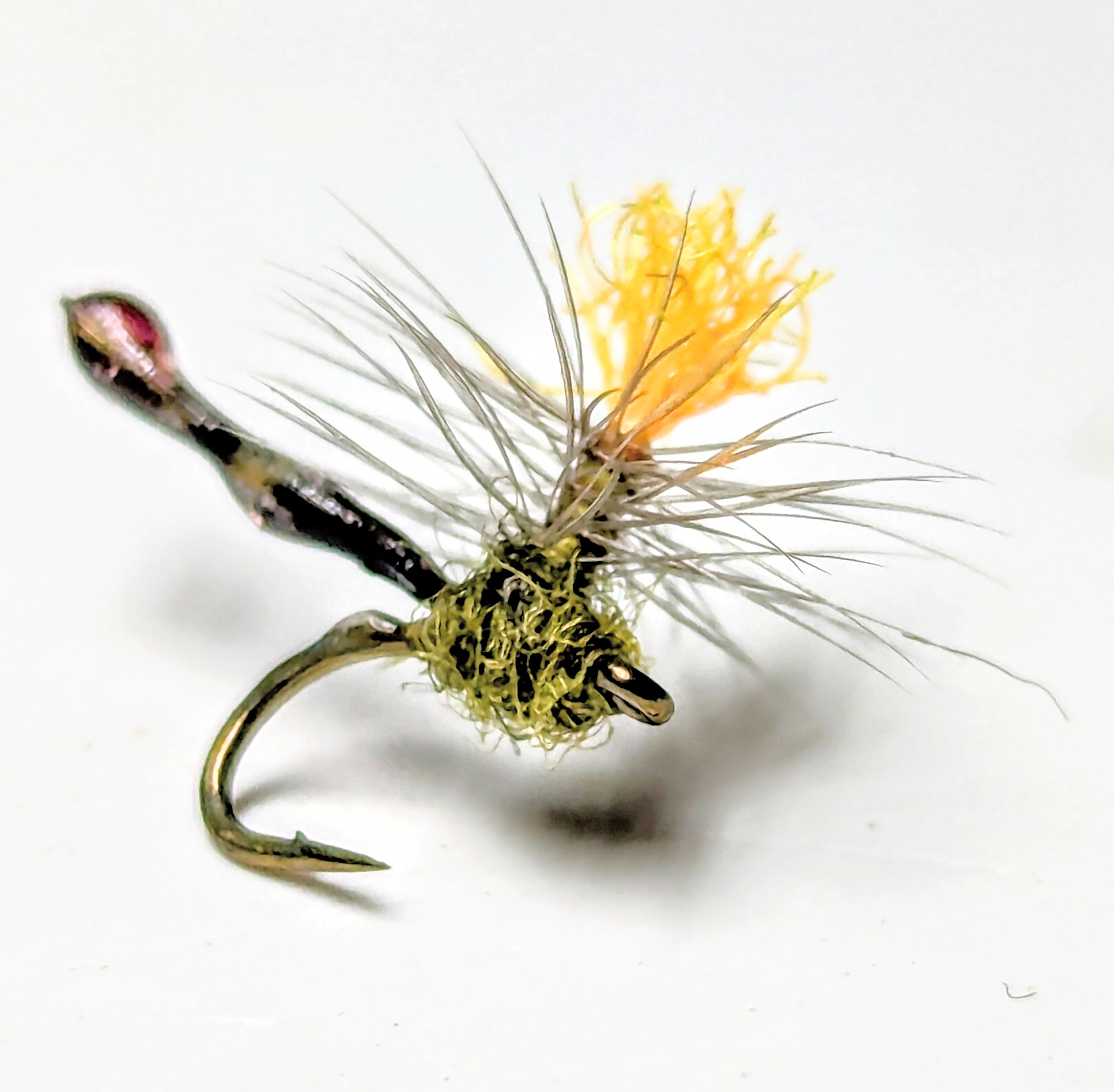 The intricate copper ribbing of a copper john fly.