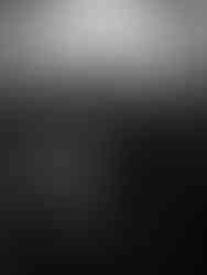 Couple walking out of the Council Chamber at Islington Town Hall after their ceremony