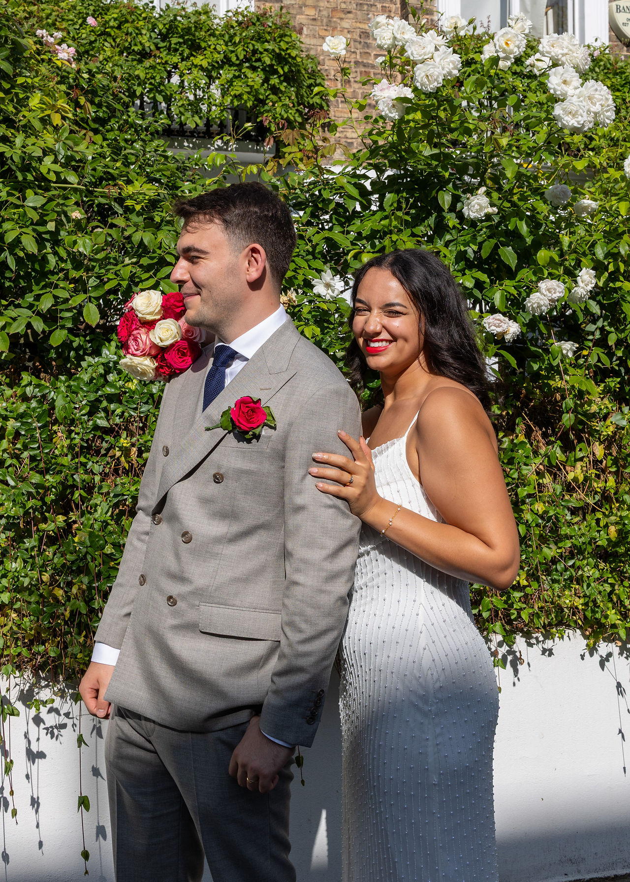 Bride and groom having wedding portraits around Chelsea after their ceremony at Old Chelsea Town Hall