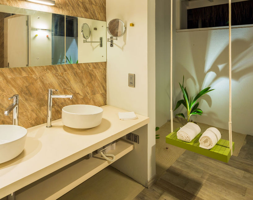 The beach villa bathrooms are large and spacious; they harmoniously echo what are the natural colors of the Maldives.