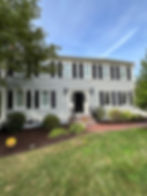 Pressure washing service restoring a driveway to its original clean appearance.