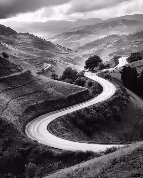 winding-road-through-rolling-hills_1179475-22831.avif