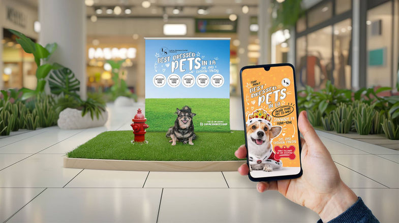 Person holding phone showing "Pawsitive Pets" mall display