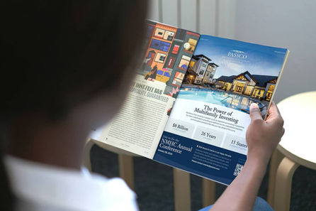 Woman reading magazine ad