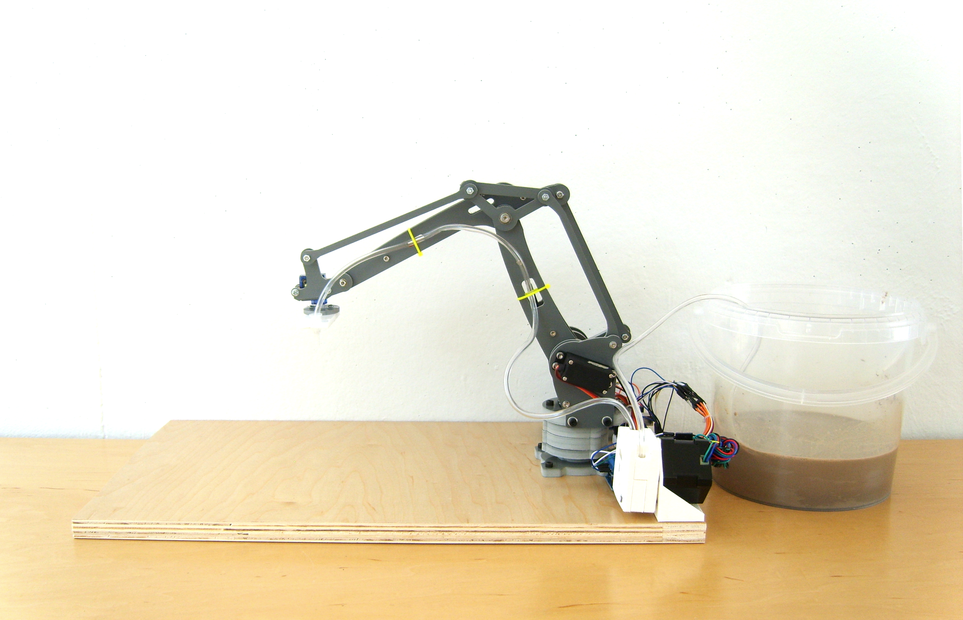 A Robot Arm with a Clay Extruder