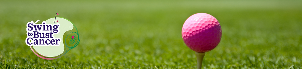 Pink golf ball placed on a tee on a grassy golf course.