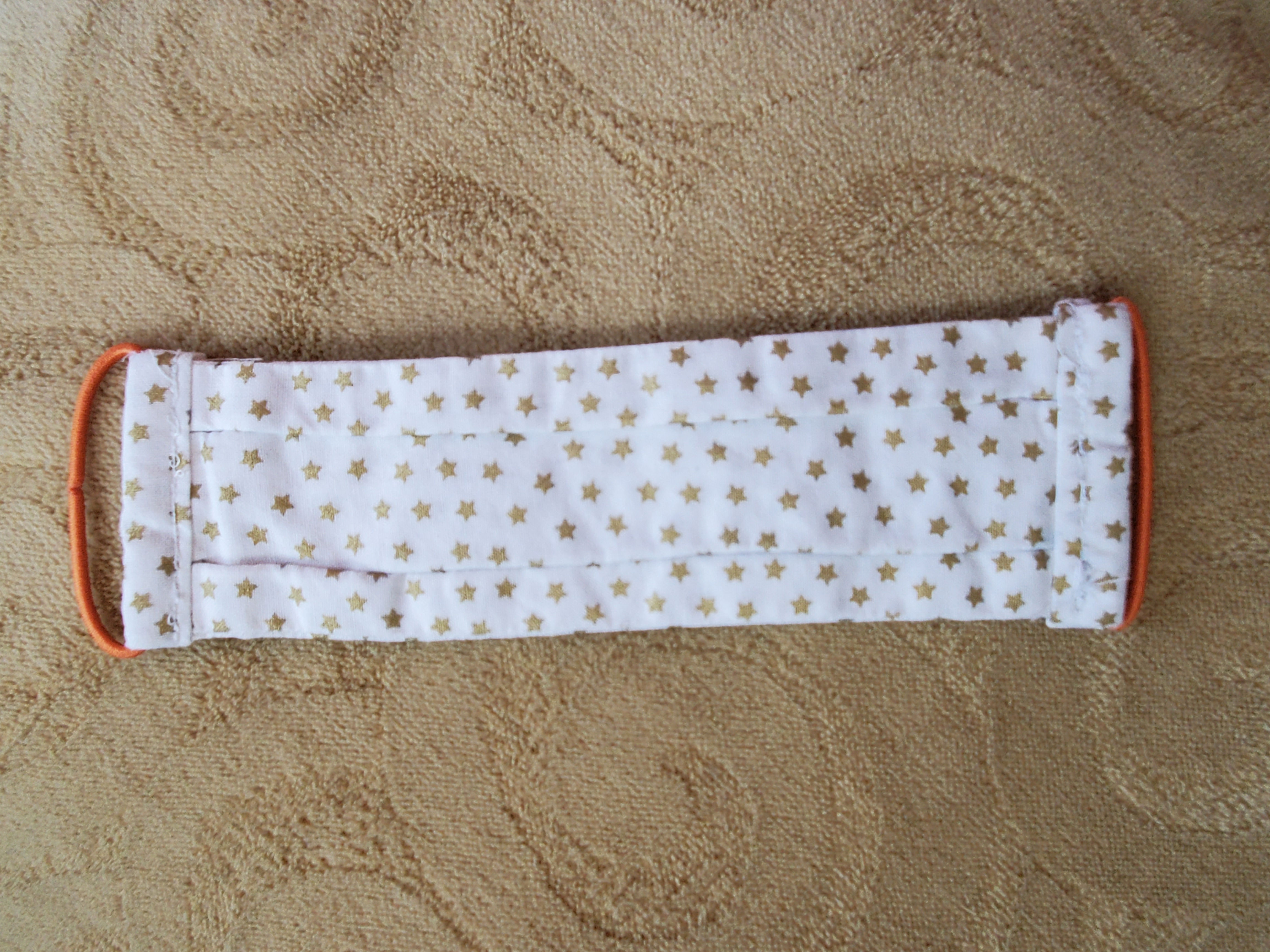 Gold Stars with orange elastics
