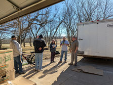Volunteers helping unload a trailer on campus at Hope Harbor