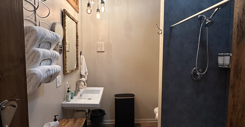 The large spacious Christie Bathroom with walk in shower and lighted make up mirror.