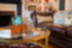 The leather couch in The Richardson Library, with drink setting.
