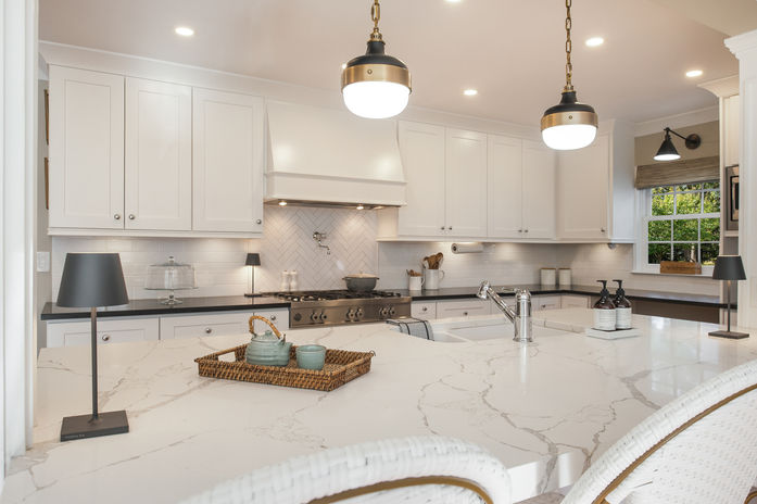 Black and white shaker style kitchen with granite and quartz counters