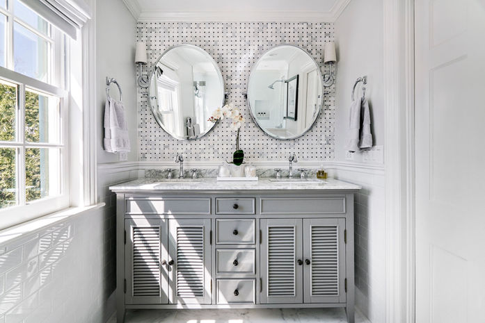 Grey and white carrara marble primary bathroom with double vanity