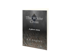 The cover shows a Celtic stone cross and a broken gravestone shrouded in mist