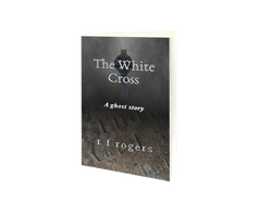 The cover shows a Celtic stone cross and a broken gravestone shrouded in mist