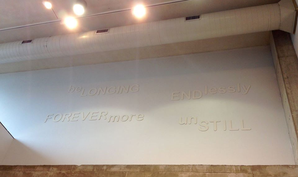 Installation view of the sculptural poem, Endlessly: The Shadow Pandemic