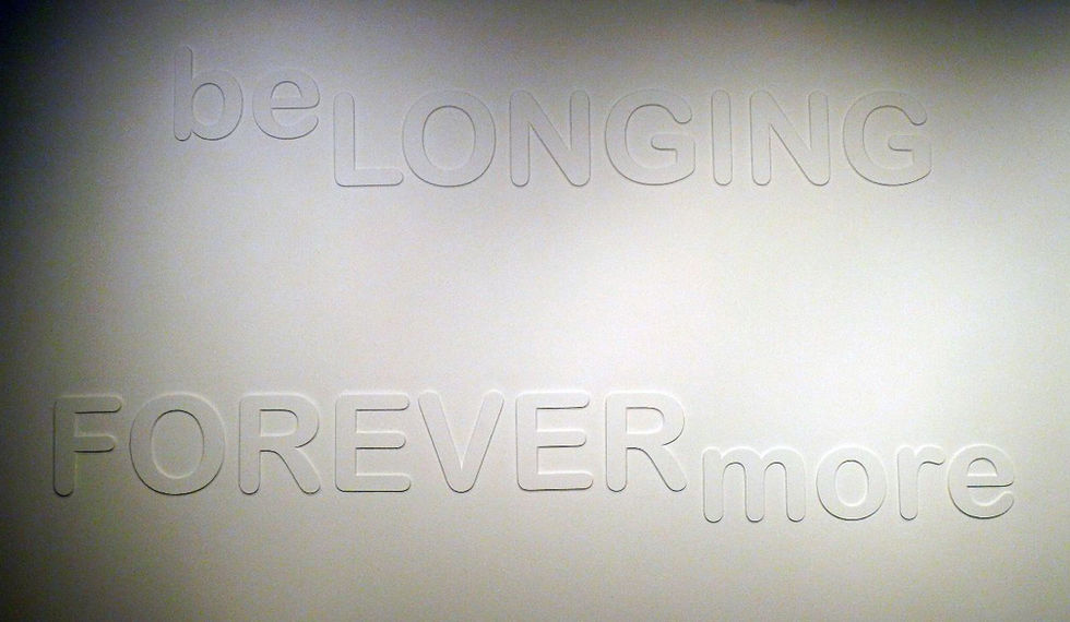 Close-up of the sculptural poem showing beLONGING FOREVERmore