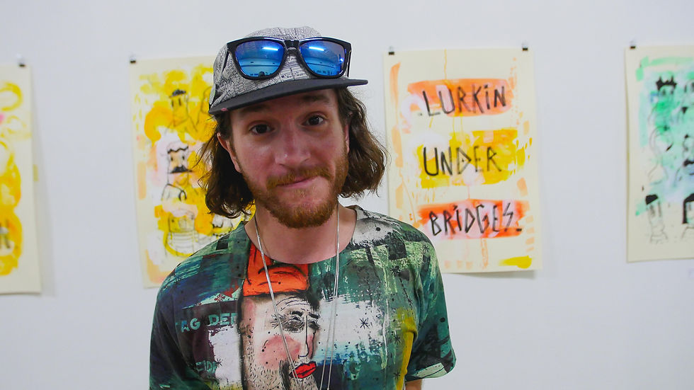 Director Ramiro in front of resident artist Grace's work