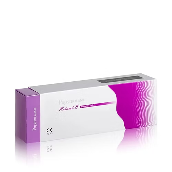 Emballage du produit PROSTROLANE NATURAL - B - 2X2 ML, un produit de comblement dermique présentant une formule avancée de rajeunissement de la peau, conçue pour l’hydratation, la restauration du volume et l’amélioration de l’élasticité cutanée.