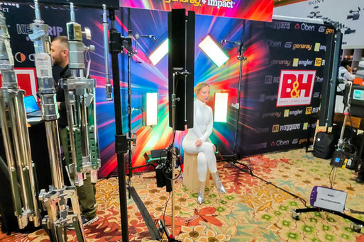 Models, exhibitors, and vendors on the WPPI expo floor