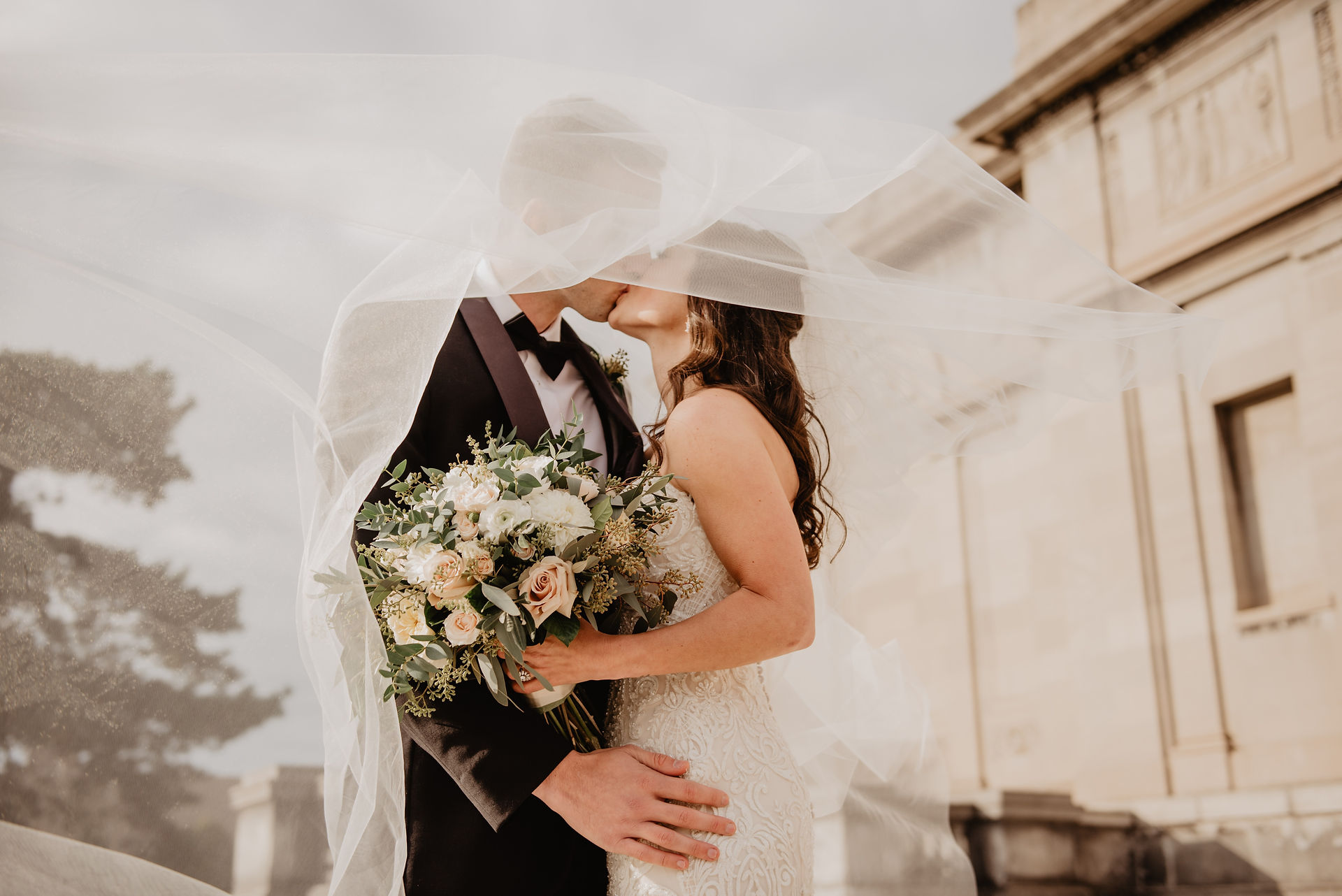 Wedding couple pose w/bouquet