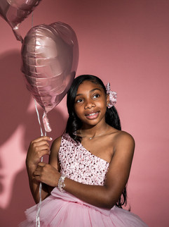 Child posing confidently in birthday session