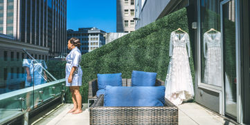 Bride on balcony with dress at Residence Inn Marriott in New Orleans
