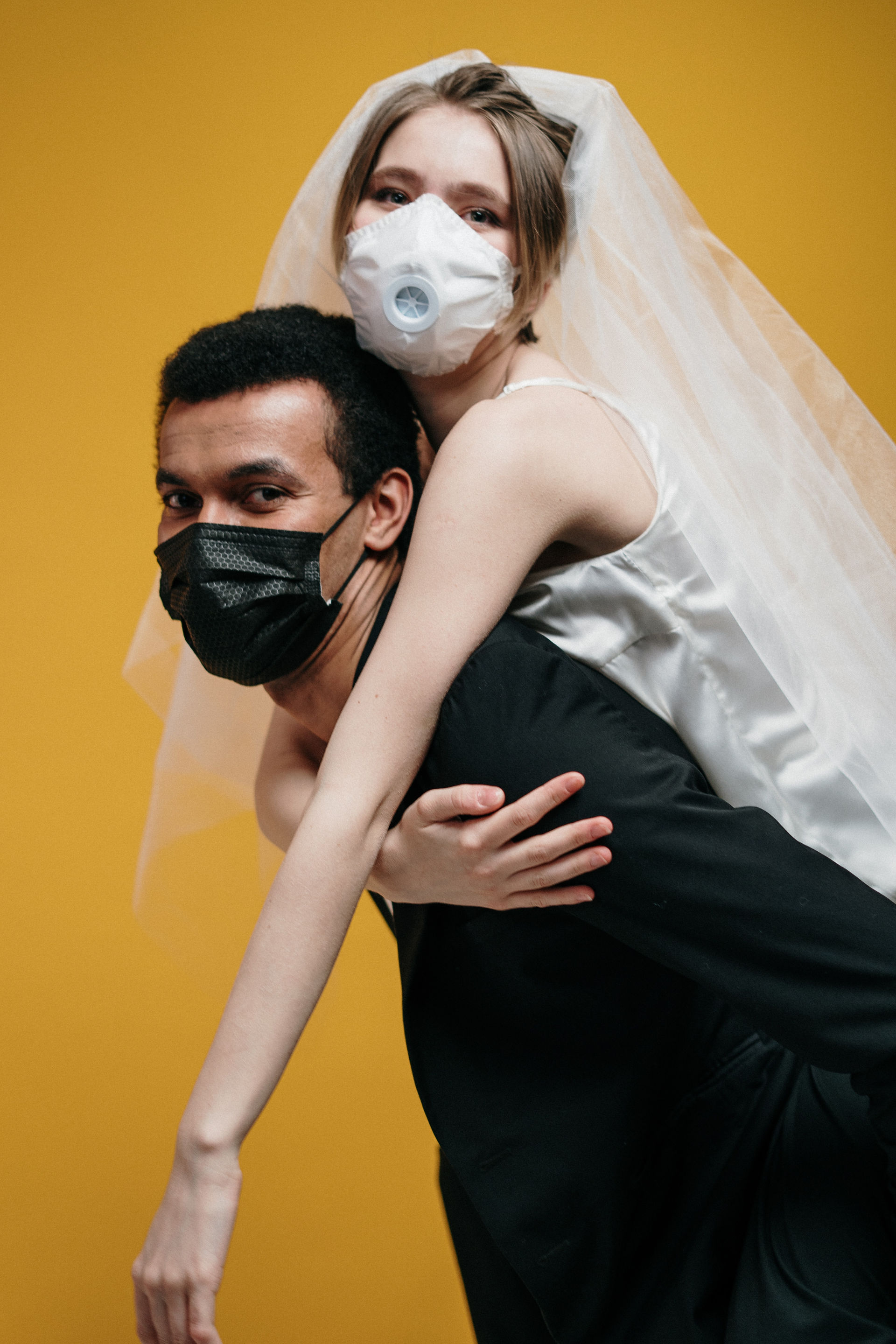 Wedding couple action pose piggyback