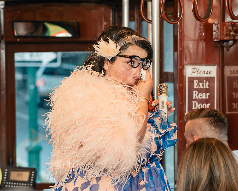 Intimate wedding vow exchange between Anne and Shawn aboard a New Orleans streetcar