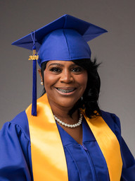 Holmes Healthcare Training Center graduate posing for an individual graduation headshot.