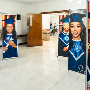 Graduate photo banners displayed at Revenge of the Nerds graduation party in New Orleans