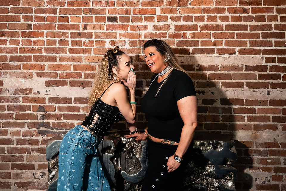Two women celebrating a 45th birthday with portraits during a New Orleans girls trip