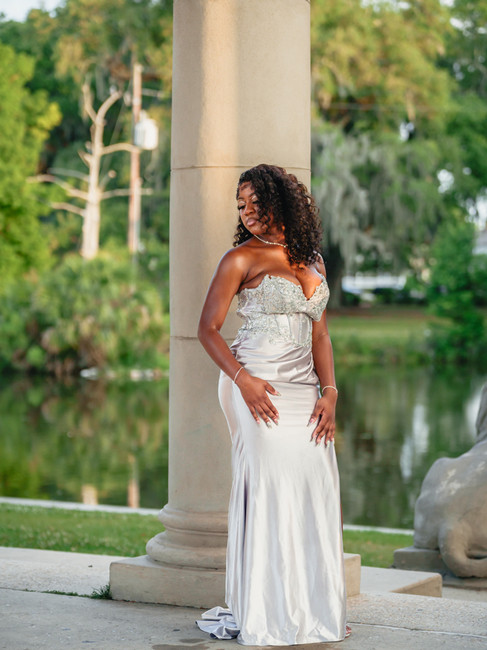 Edna Karr prom portrait of young lady framed by City Park Peristyle columns